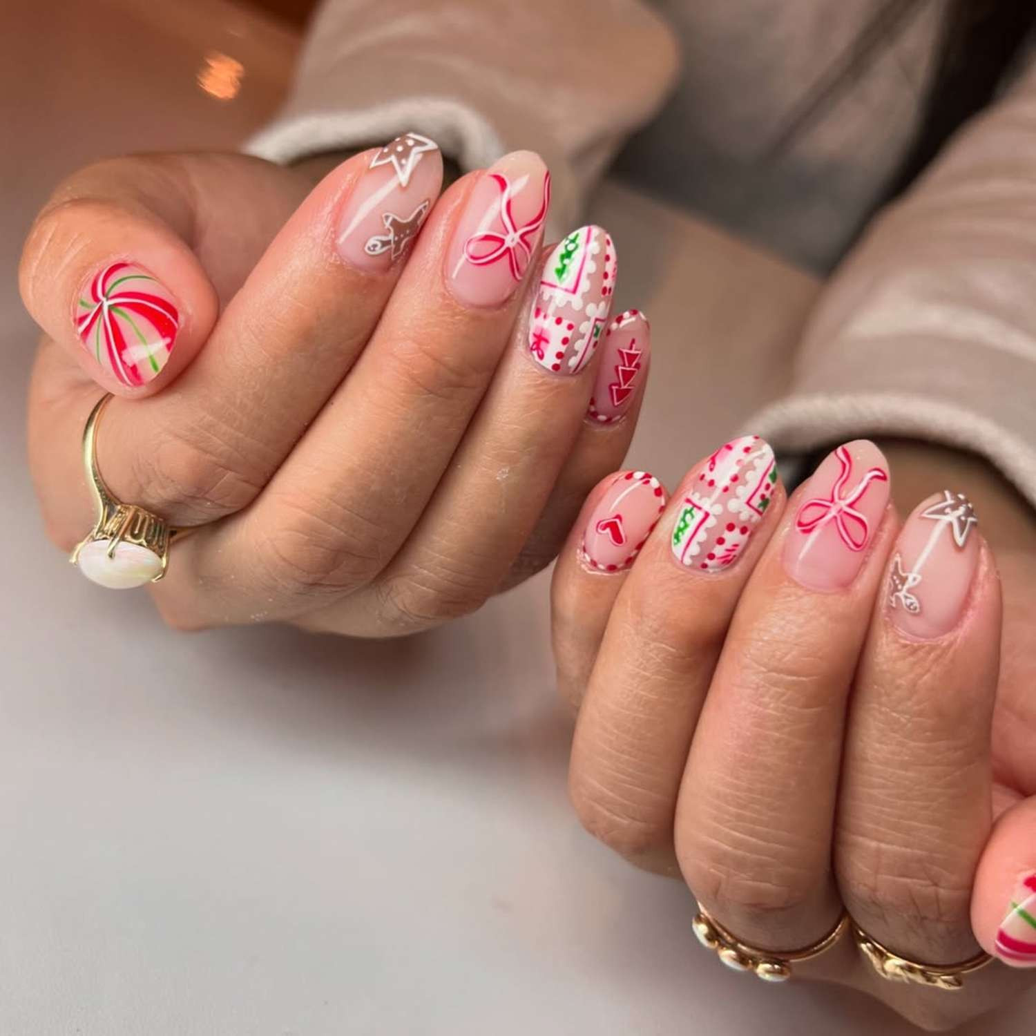 Sheer Pink Christmas Motif Medium Almonds Sheer Pink Christmas Motif Medium Almonds — Christmas Nail Art 2026