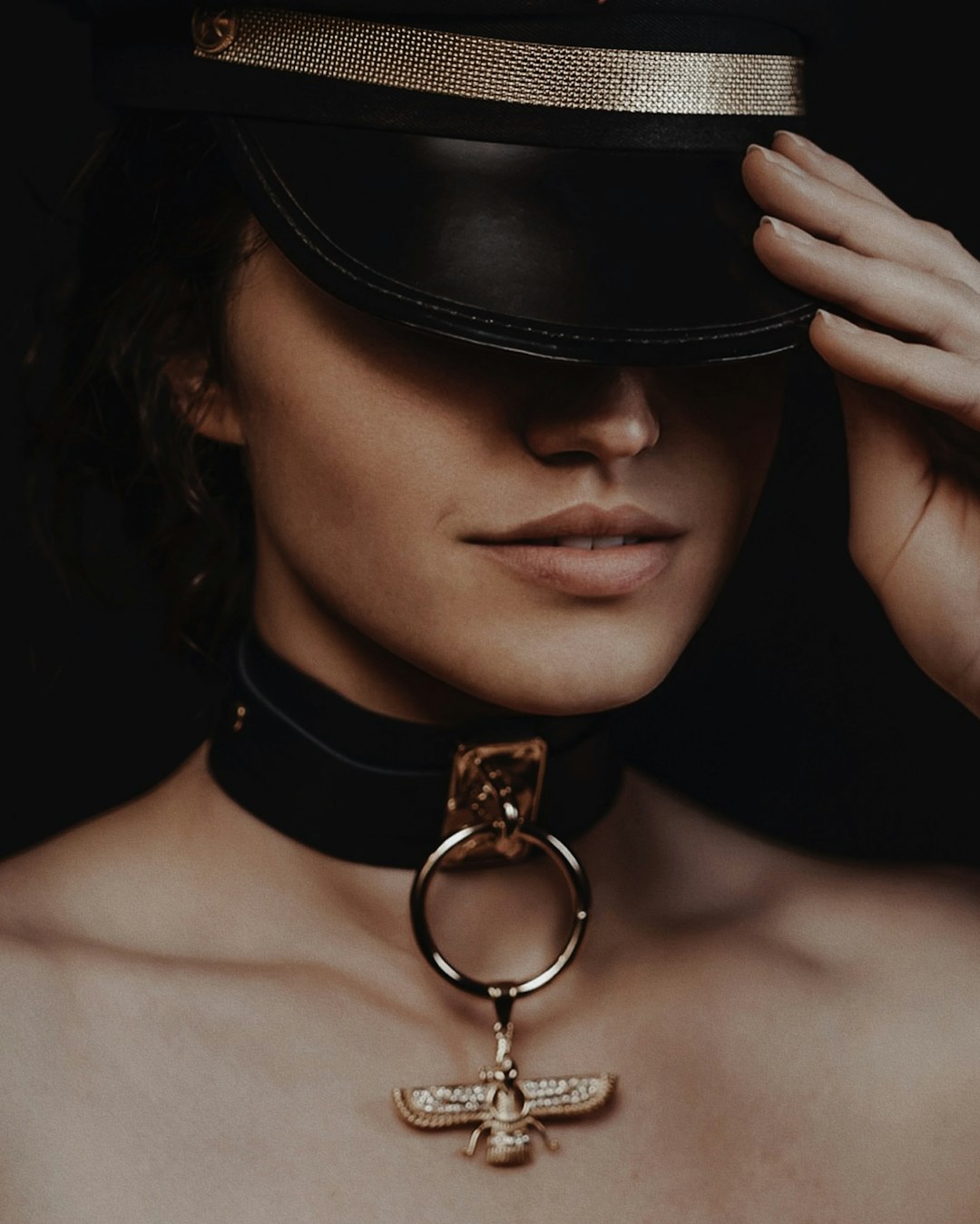 Edgy Pendant: Ornate Gold Detail on Leather Choker — Jewelry Trends 2027