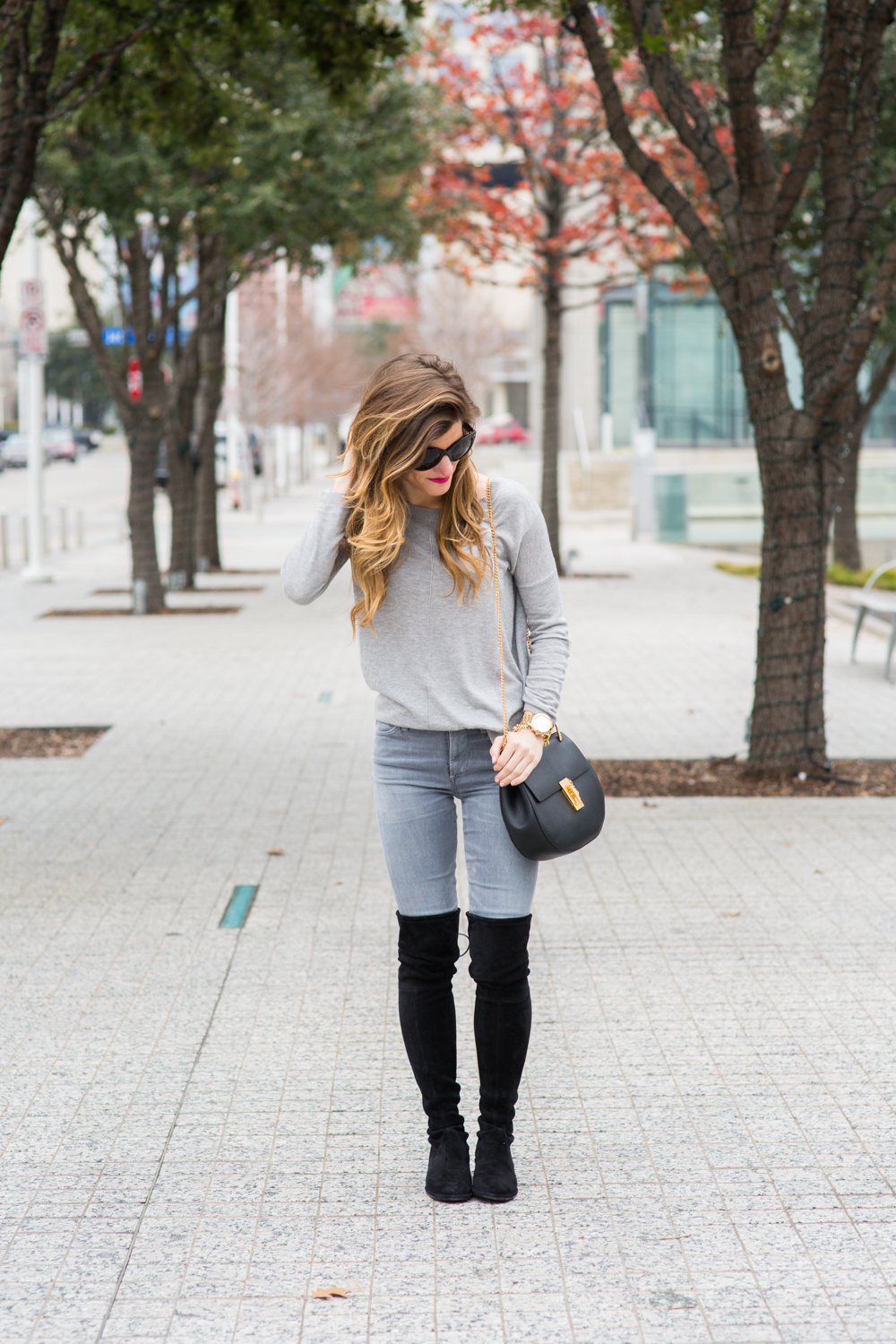 Fitted Grey Sweater with Skinny Jeans and Over-the-Knee Boots Fitted Grey Sweater with Skinny Jeans and Over-the-Knee Boots — Winter Grey Outfits 2027