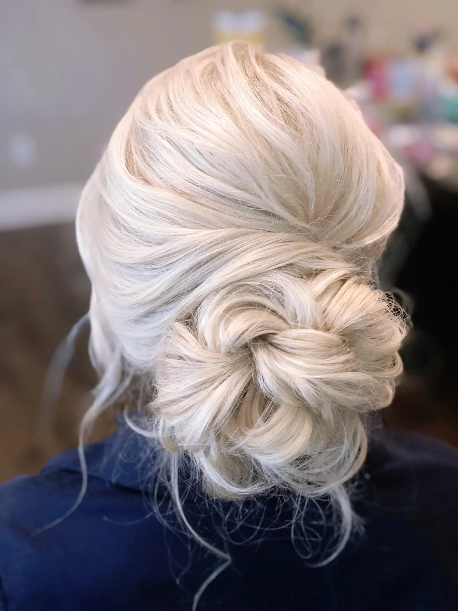 Ash Blonde Braided Bun With Tendrils Ash Blonde Braided Bun With Tendrils — Mother of the Bride Updos 2027