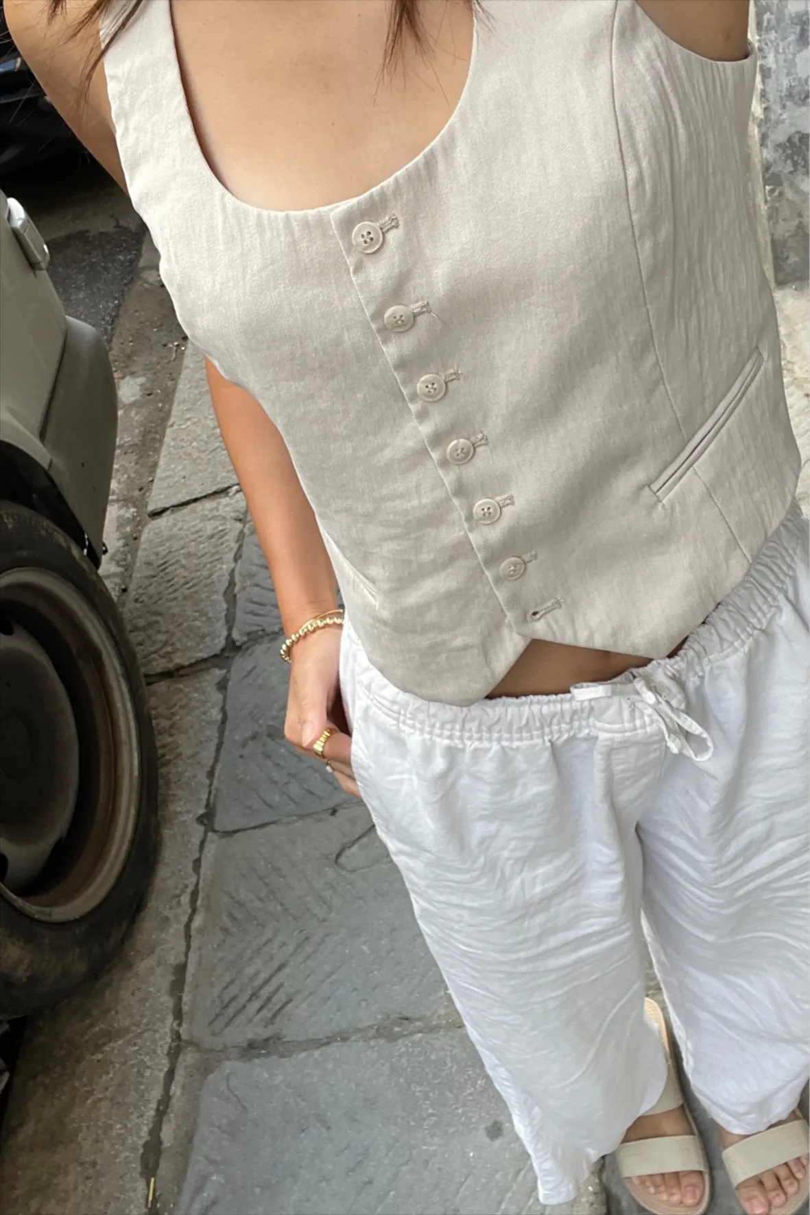 Beige Sleeveless Vest and White Drawstring Pants Beige Sleeveless Vest and White Drawstring Pants — Travel Outfits Europe 2027