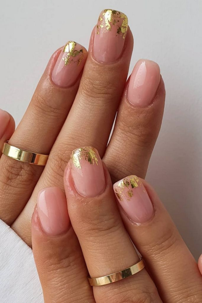 Pinkish Nude with Gold Foil Tips Pinkish Nude with Gold Foil Tips — Short New Years Nails 2027