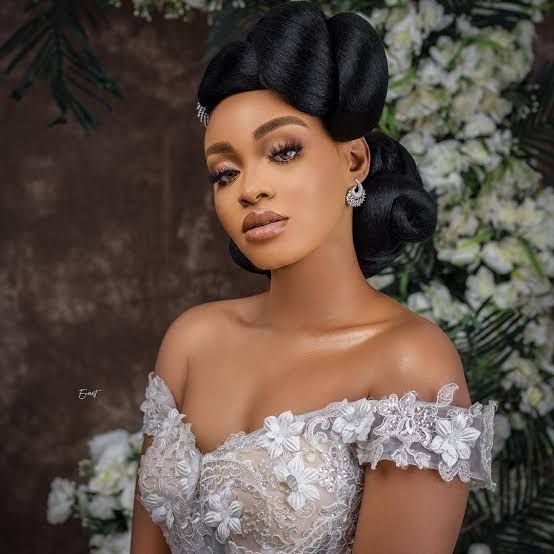 Sculpted Black Updo with Volume Sculpted Black Updo with Volume — Wedding Hairstyles 2027 with Weave