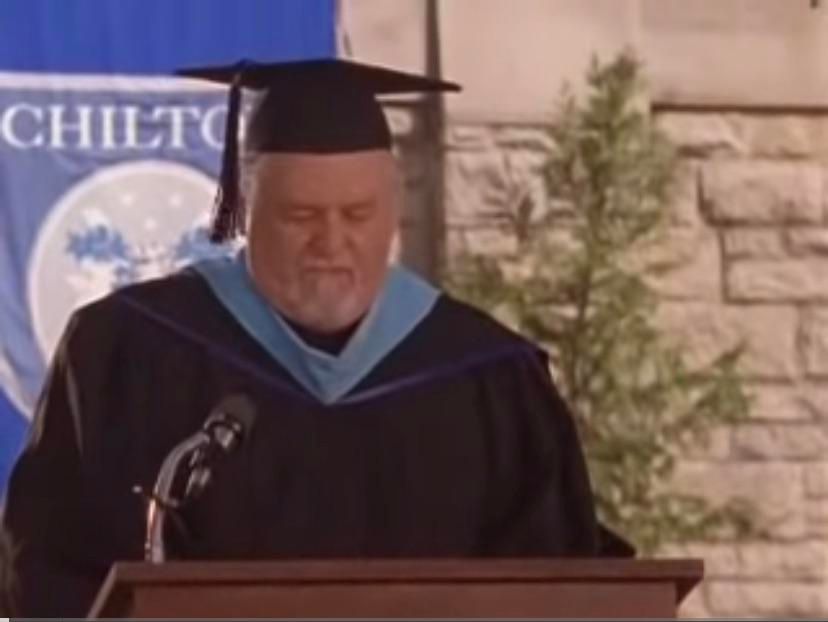 Academic Regalia with Blue and White Trim at the Podium — Graduation Speaker Outfits 2027