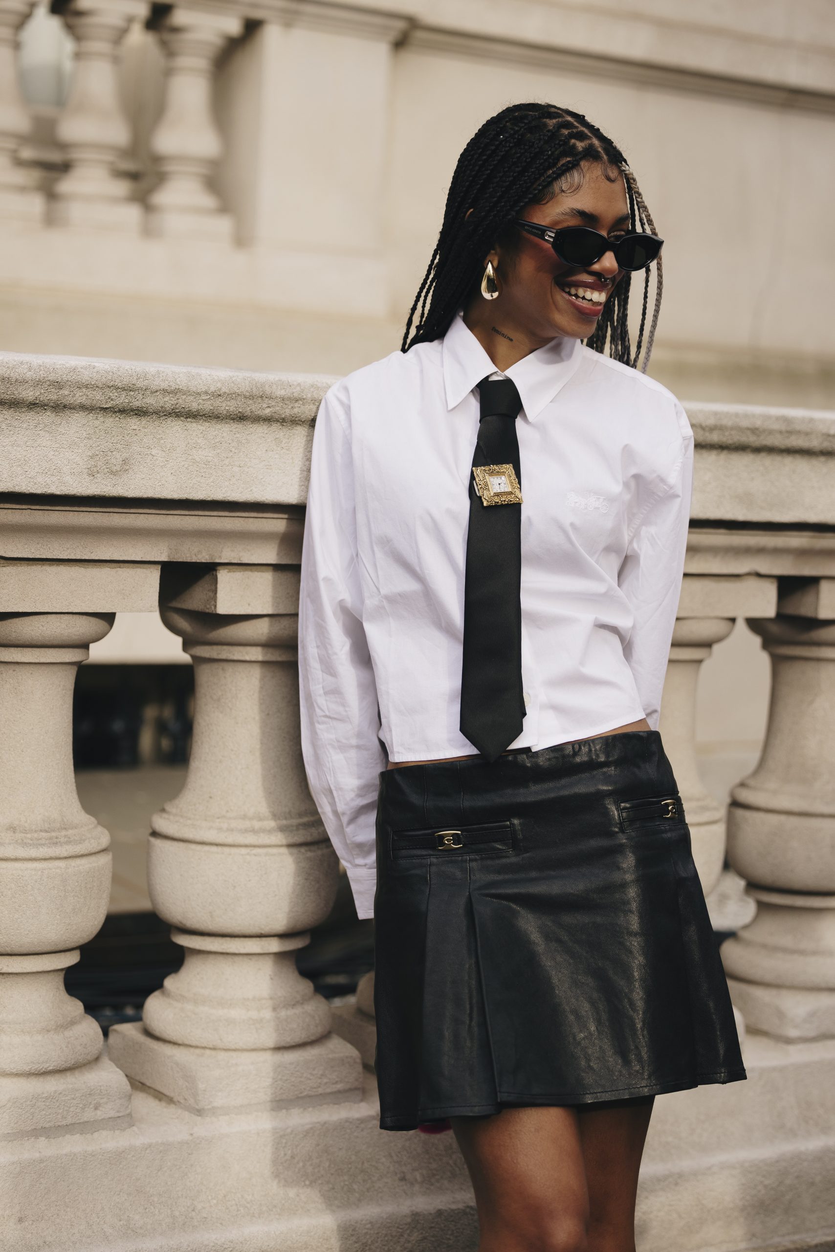 Edgy Ensemble: Ornate Brooch on a Tie with Mini Skirt and Blazer Edgy Ensemble: Ornate Brooch on a Tie with Mini Skirt and Blazer — Brooch Outfits 2027