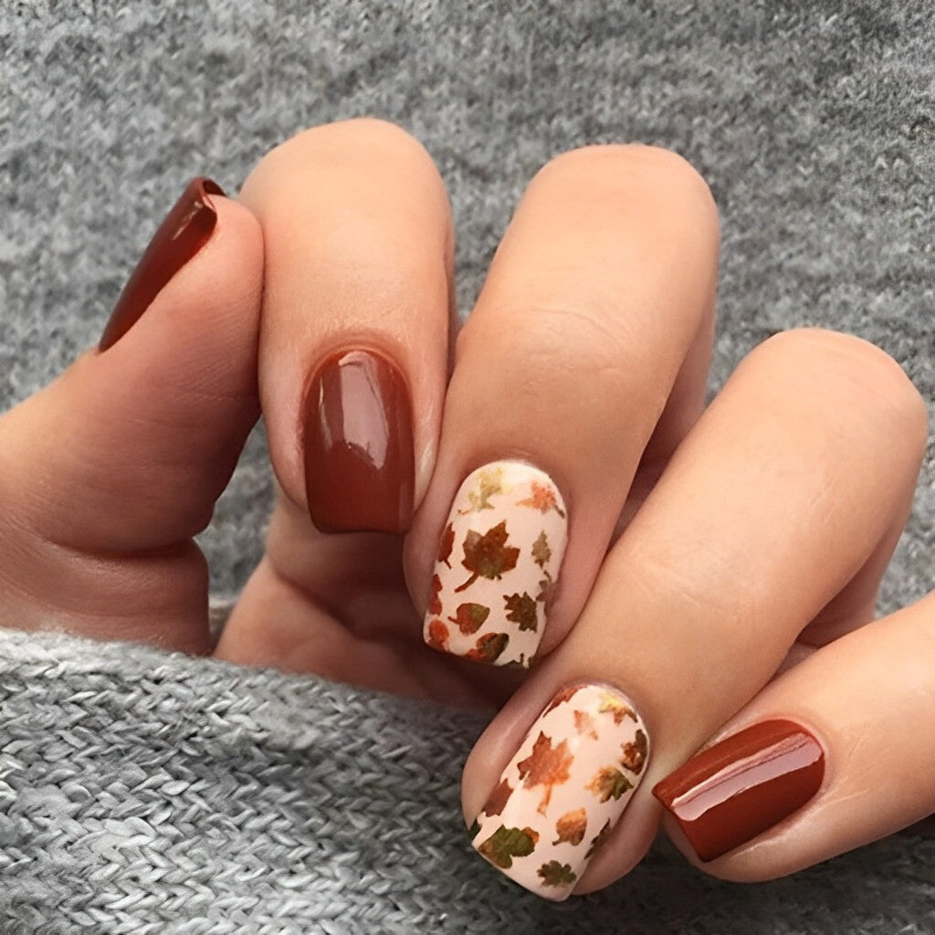 Medium Brown with Scattered Leaf Decals — Simple Thanksgiving Nails 2026