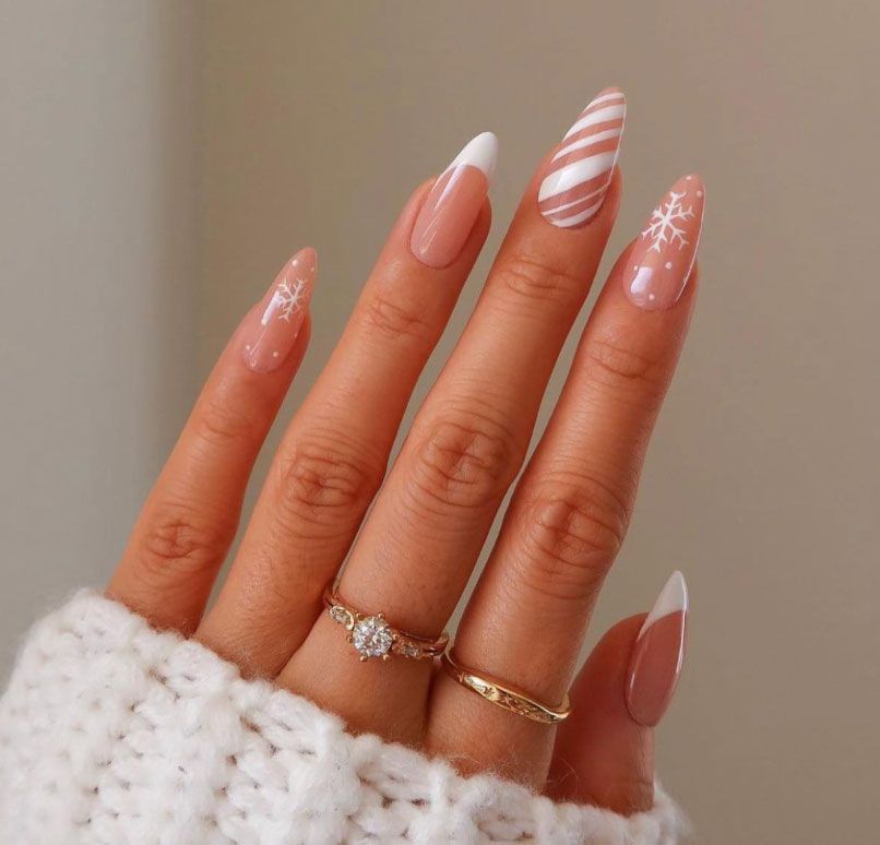 Sheer Nude Snowflake French Almond Nails Sheer Nude Snowflake French Almond Nails — Neutral Christmas Nails 2026