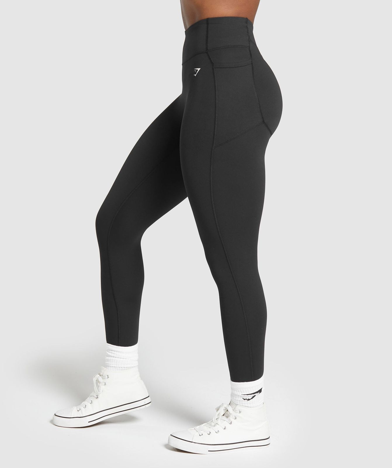 Black High-Waisted Leggings with White High-Tops — Athletic Hiking Outfits 2027