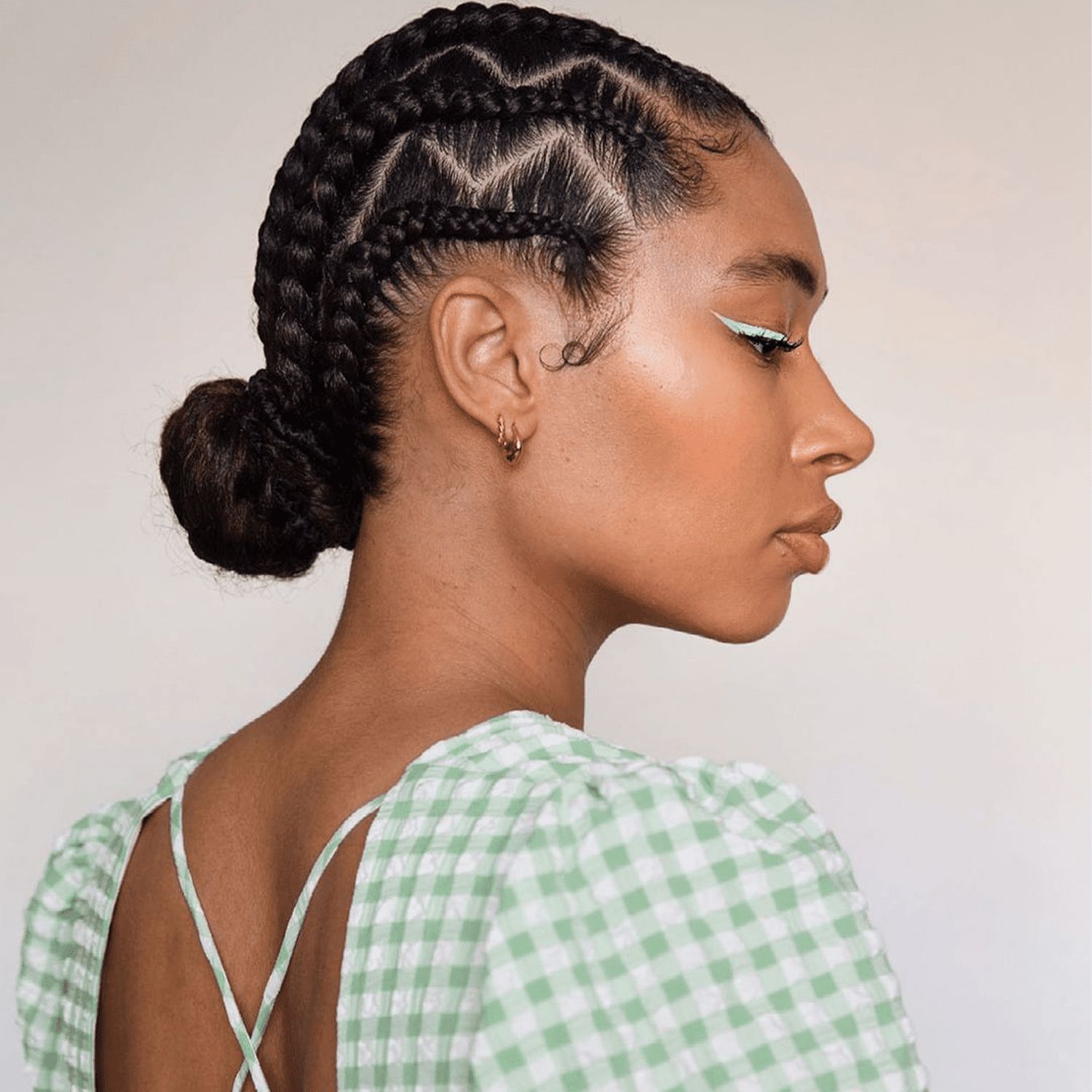 Zig-Zag Cornrows Into Low Bun Zig-Zag Cornrows Into Low Bun — Protective Vacation Hairstyles 2027