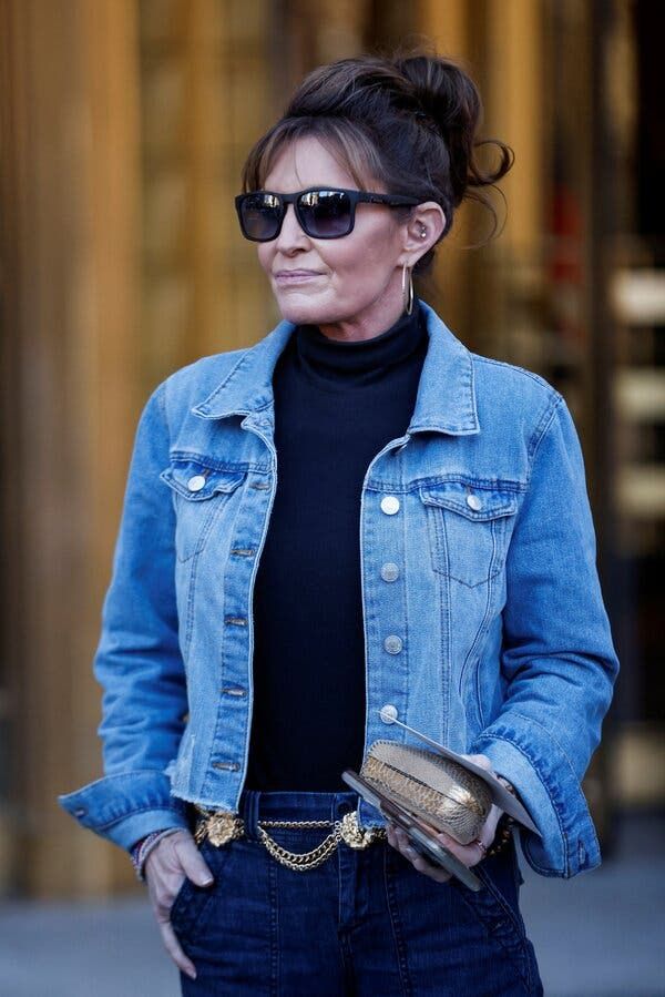 Blue Denim Jacket with Black Skinny Jeans and Tan Crossbody — Denim Jackets 2027