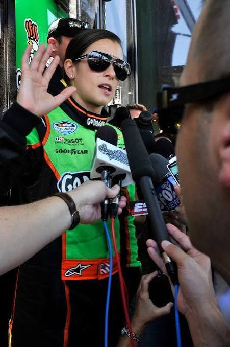 Green and Black Racing Suit with Orange Accents — NASCAR Outfits 2027