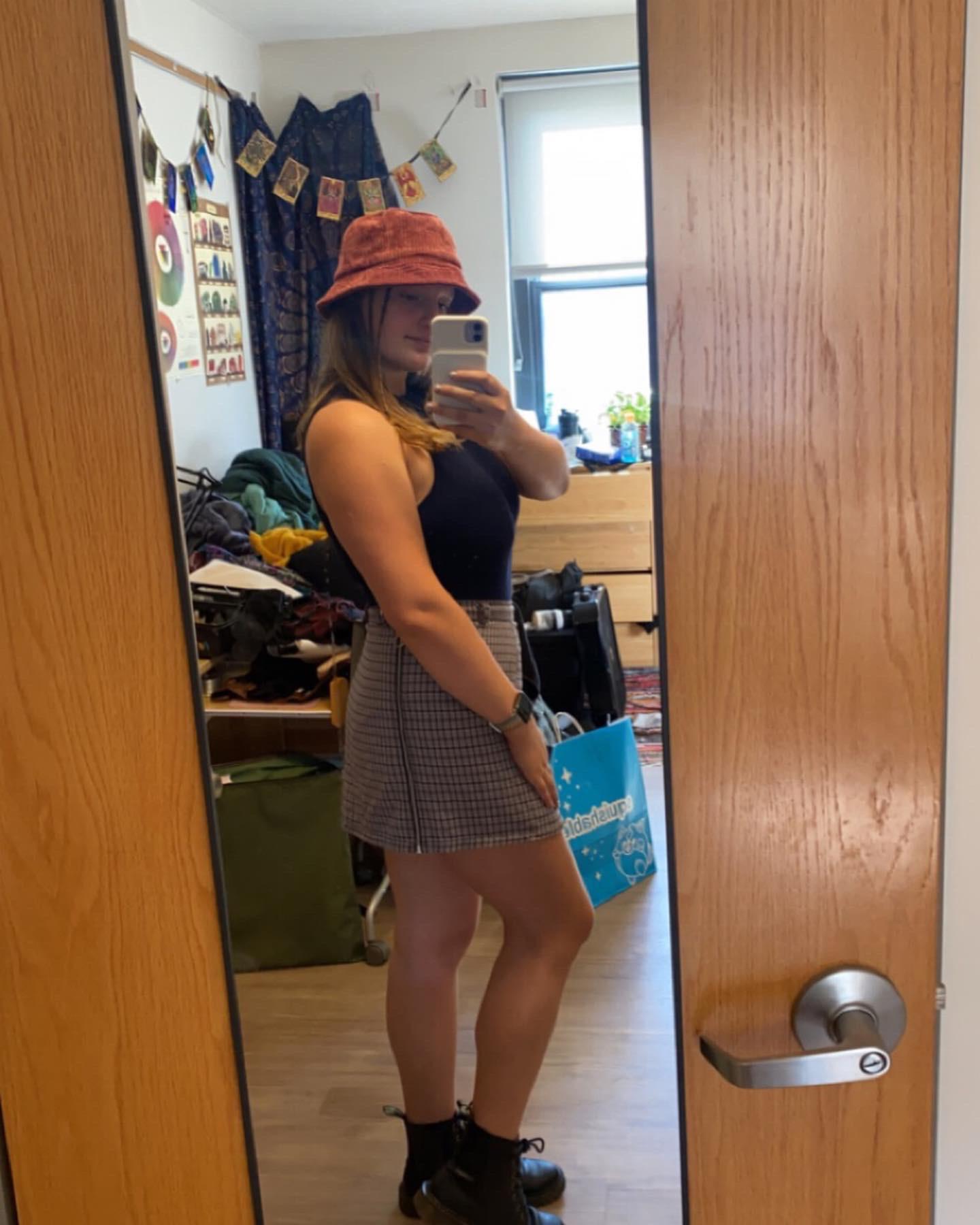 Long Layers Mid-Back Wavy Medium Brown With Red Hat — Bucket Hat Hairstyles 2027