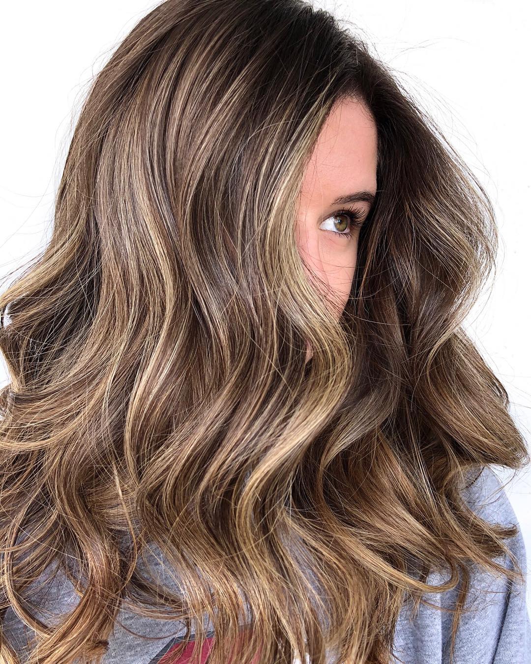 Dark Brown With Sun-Kissed Highlights — Hair Color 2027 for Hazel Eyes