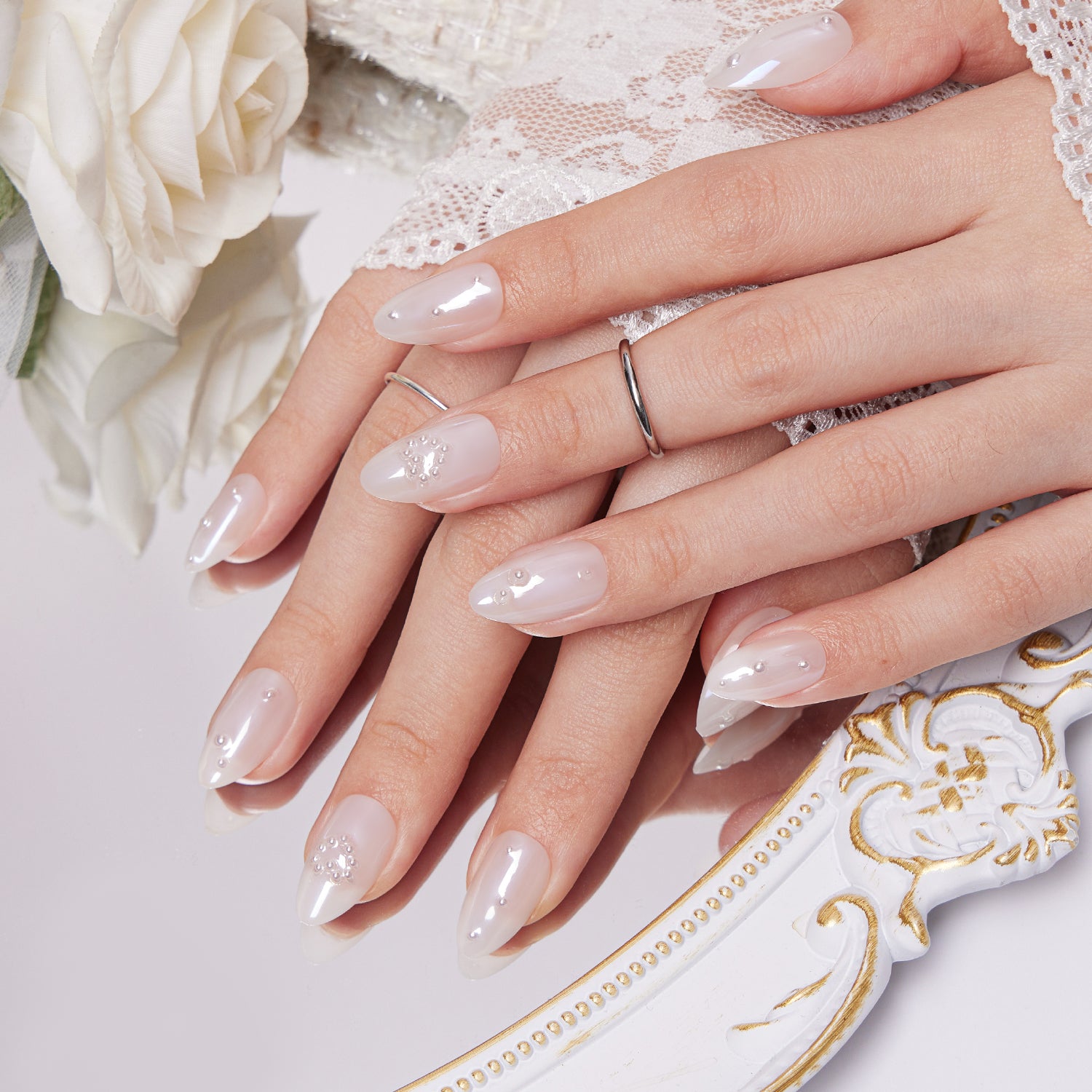 Milky White Stilettos with Rhinestones and Pearls Milky White Stilettos with Rhinestones and Pearls — Classy Wedding Nails 2027