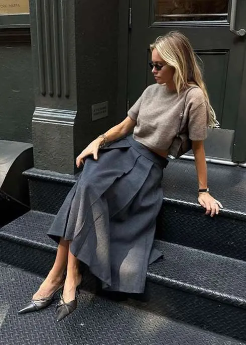 Charcoal Asymmetrical Pleated Midi Skirt with Cropped Grey Sweater — Pleated Skirt Outfits 2027