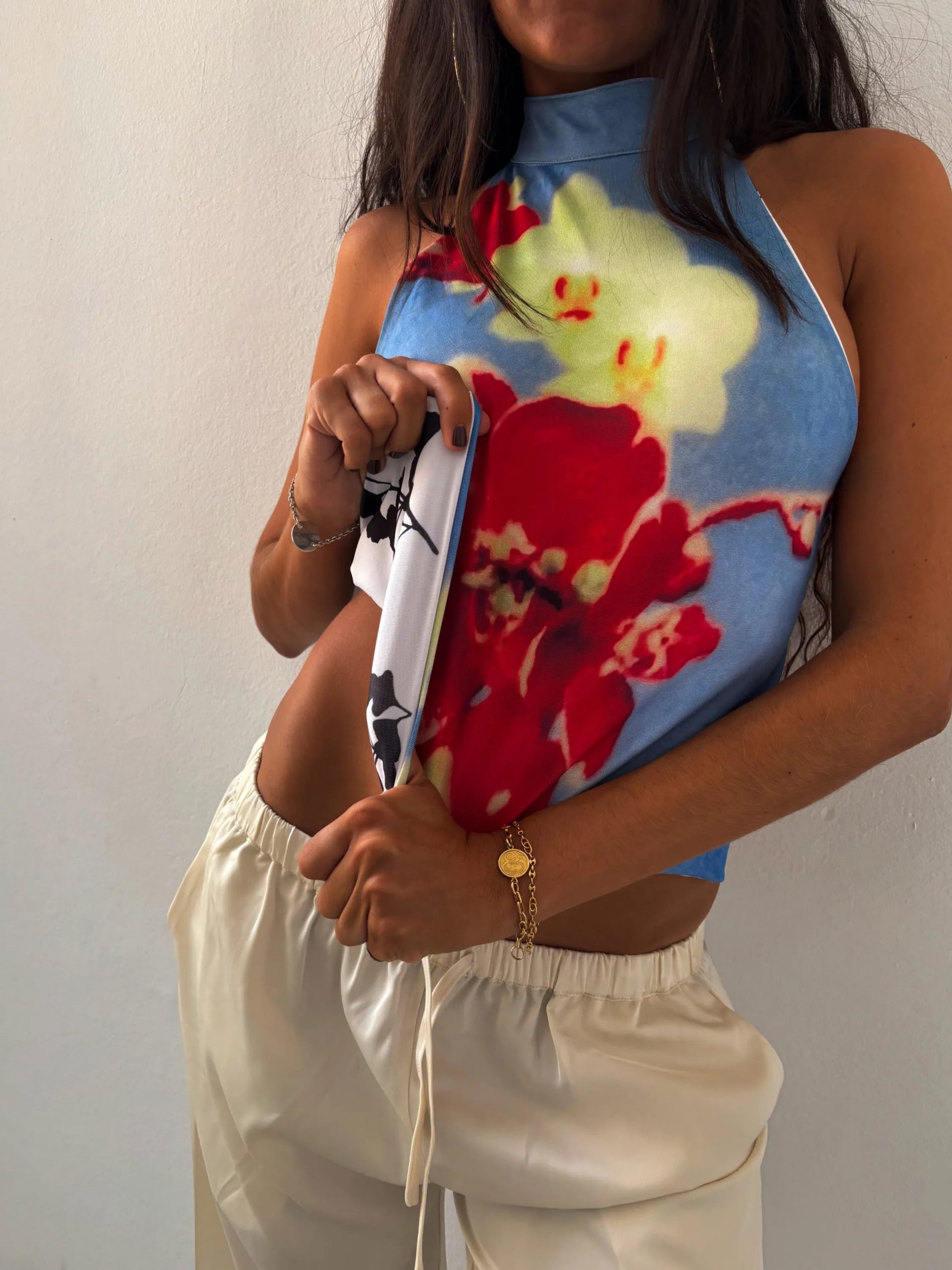 Vibrant Floral Halter Top with Cream Wide-Leg Trousers — Barcelona Outfits 2027