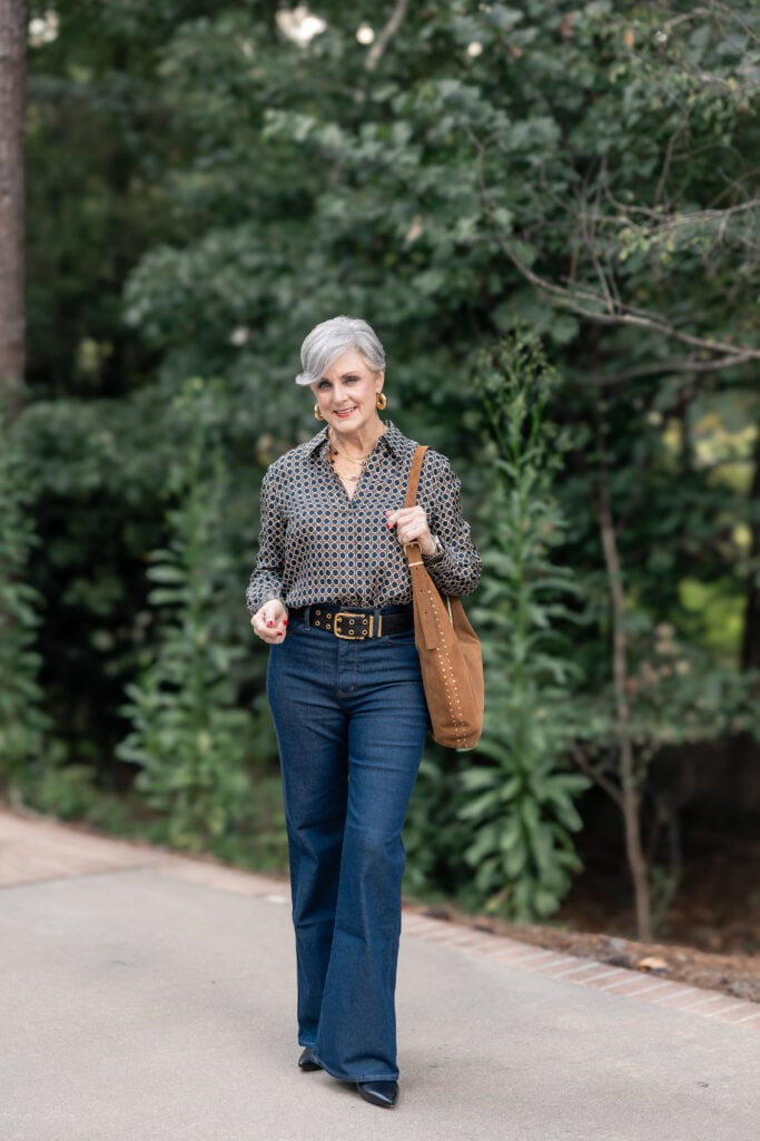 Navy and Gold Geometric Print Blouse with Flared Jeans Navy and Gold Geometric Print Blouse with Flared Jeans — Date Night Outfits 2027 for Women Over 50