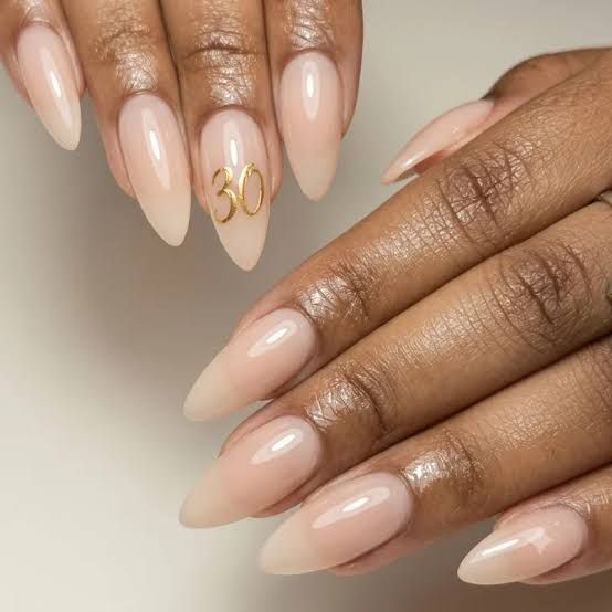 Sheer Nude Medium Stiletto with Glossy Gold '30' — 30th Birthday Nails 2027