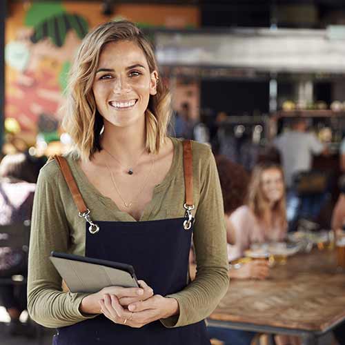 Olive Green Top Under Navy Apron for Professional Hosting Olive Green Top Under Navy Apron for Professional Hosting — Hostess Outfits 2027