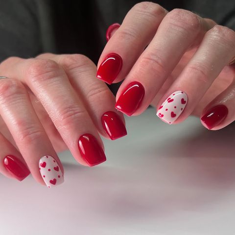 Vibrant Red With Scattered White Hearts Vibrant Red With Scattered White Hearts — Red Valentines Nails 2027