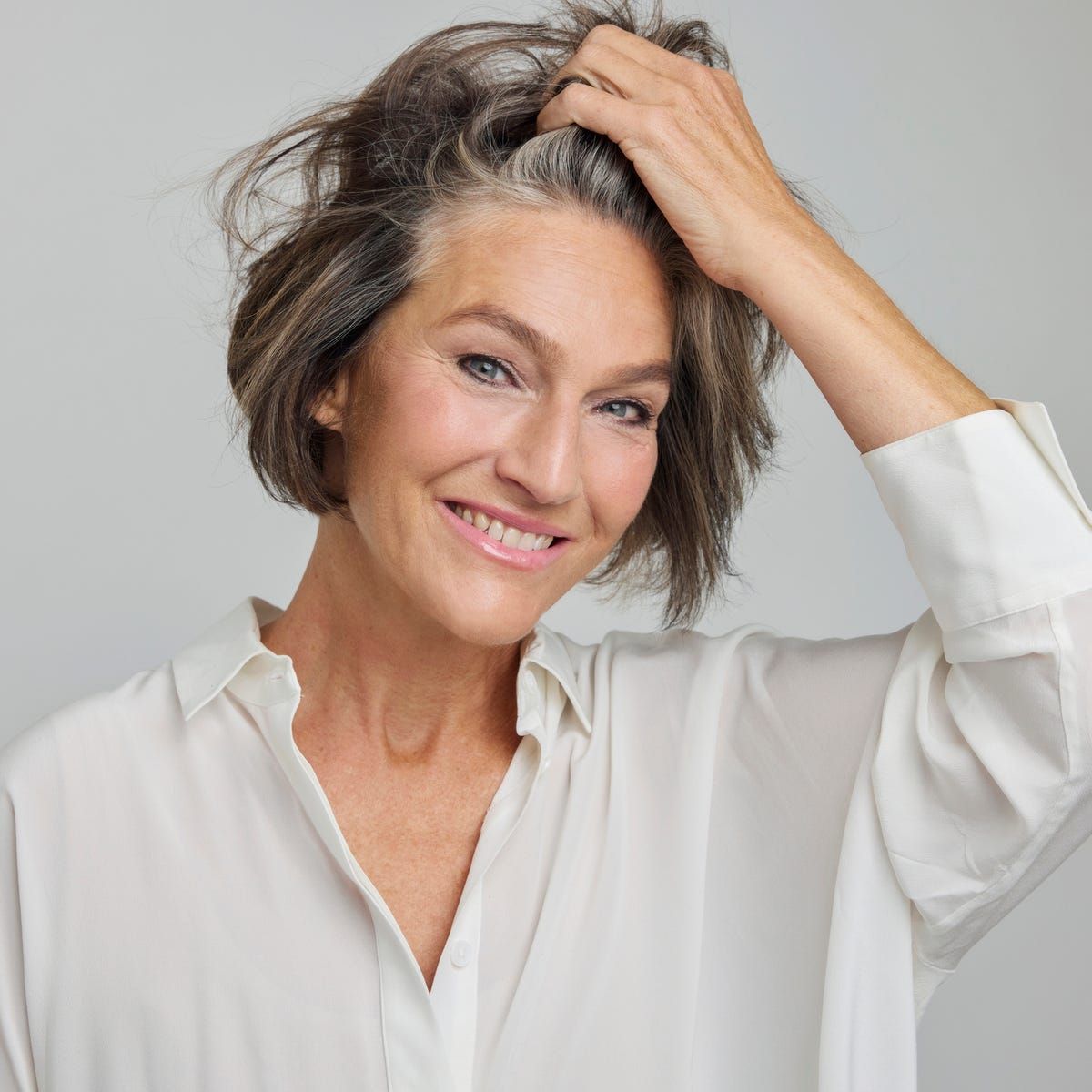 Collarbone Layers With Tousled Texture — Transitioning to Gray Hair 2027
