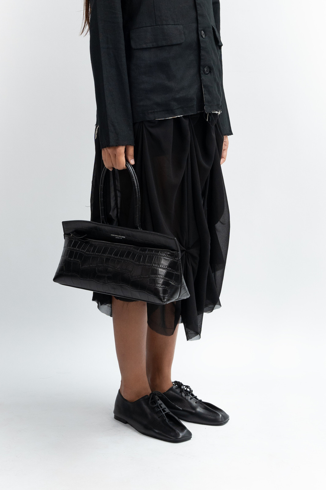 Black Oversized Jacket, Draped Skirt, and Textured Baguette Black Oversized Jacket, Draped Skirt, and Textured Baguette — Baguette Bag Aesthetic 2027
