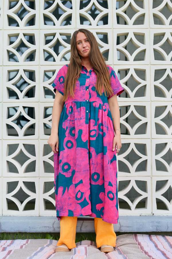 Bold Floral Print Dress Layered Over Wide-Leg Pants Bold Floral Print Dress Layered Over Wide-Leg Pants — Pool Party Outfits 2027