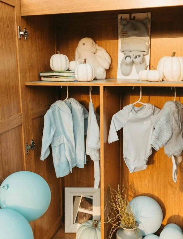 Soft Blue and Grey Baby Outfit Display Soft Blue and Grey Baby Outfit Display — Gender Reveal Outfits 2027