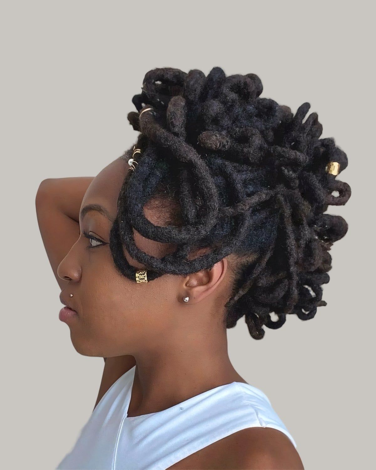 Voluminous Side Locs Updo With Gold Beads Voluminous Side Locs Updo With Gold Beads — Loc Styles 2027 for Black Women