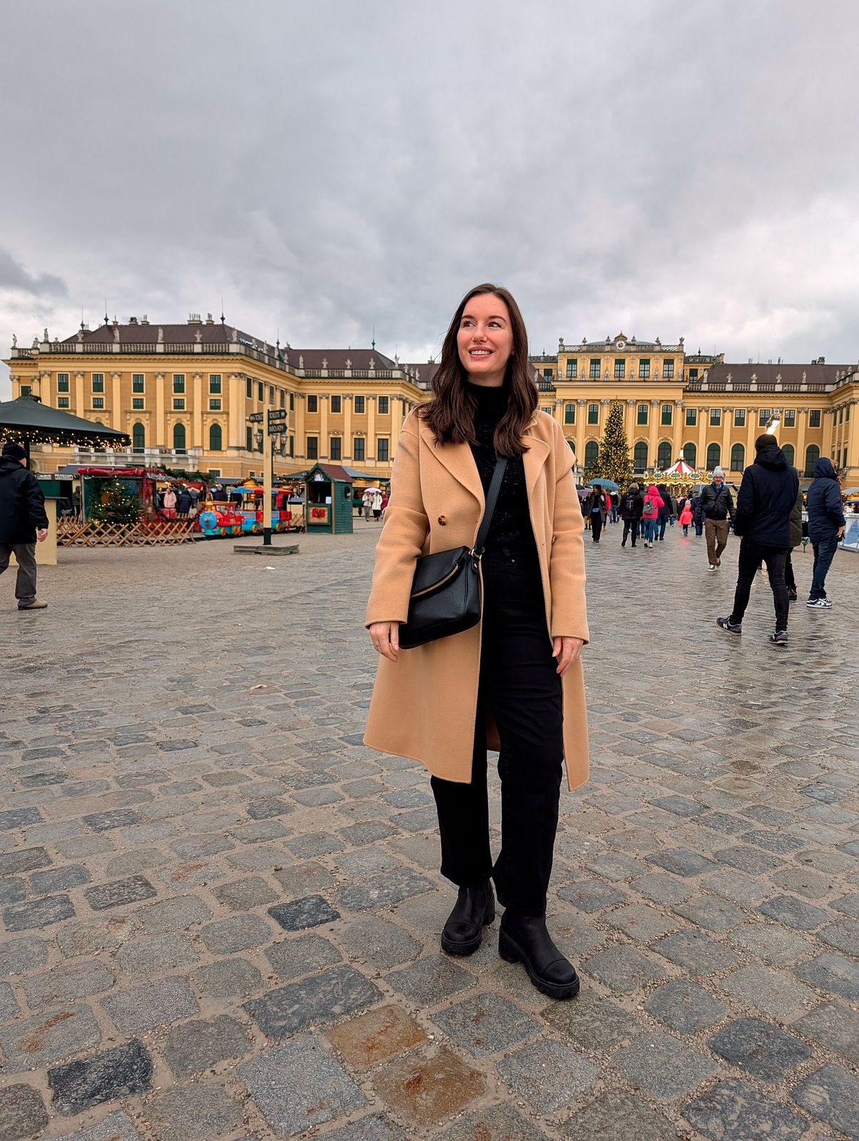 Classic Camel Coat with Black Accents for Market Exploration — Christmas Market Outfits 2026