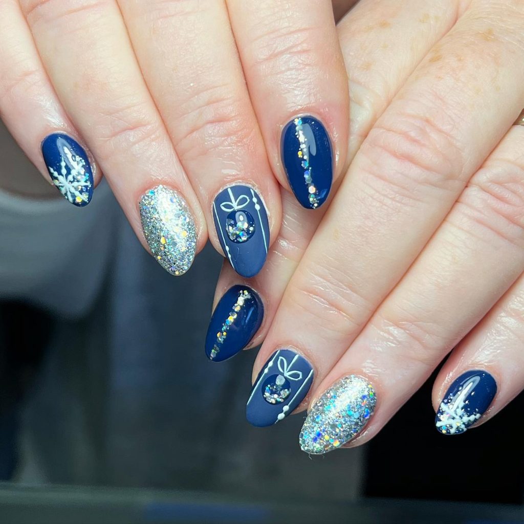 Short Oval Navy Snowflake and Glitter Art Short Oval Navy Snowflake and Glitter Art — Blue Christmas Nails 2026