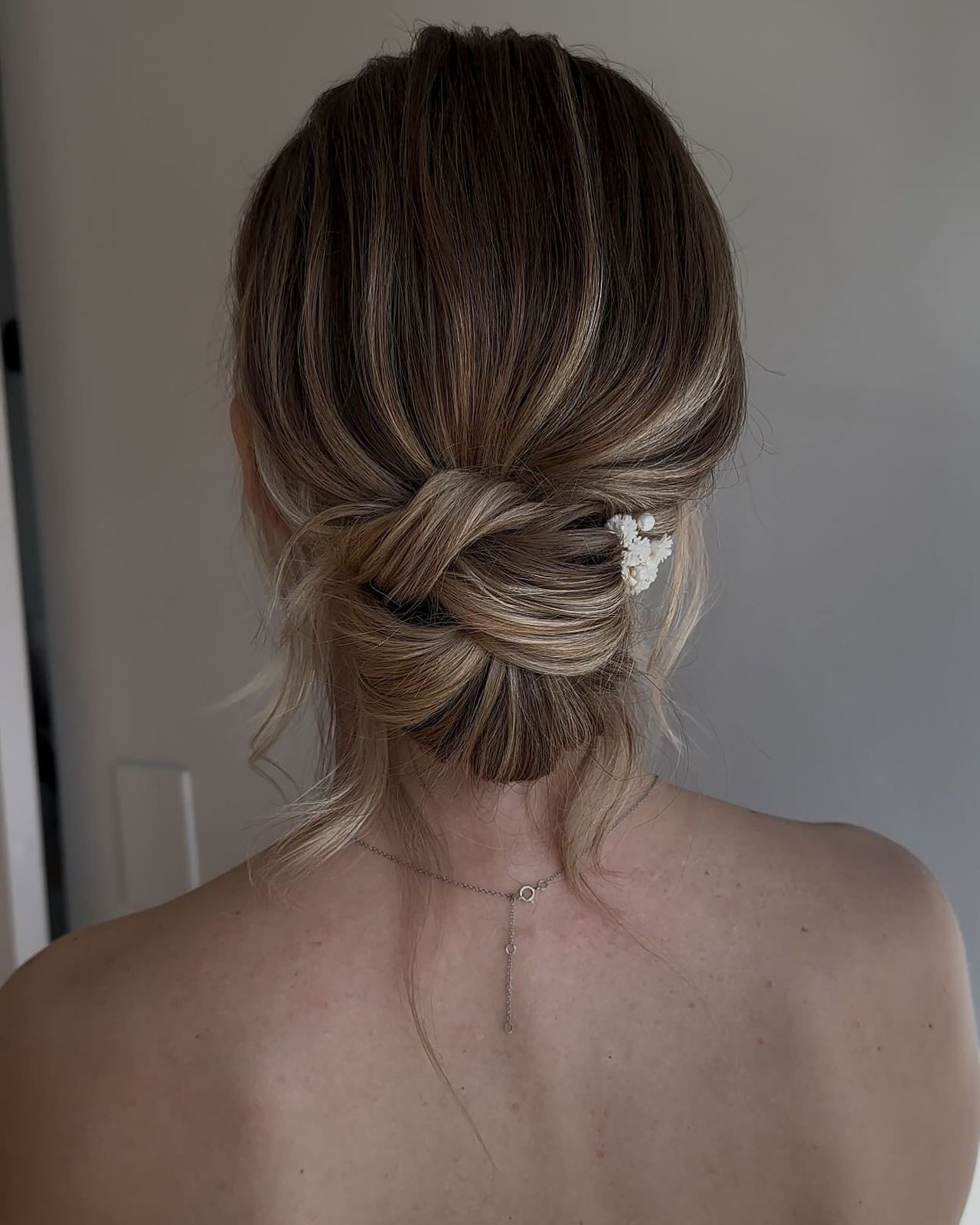 Low Messy Bun With Knot Detail Visual Idea Low Messy Bun With Knot Detail Visual Idea — Messy Low Bun 2027