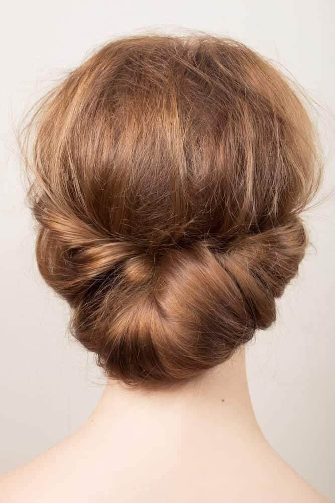 Low Twisted Bun — Holiday Party Hairstyles 2026