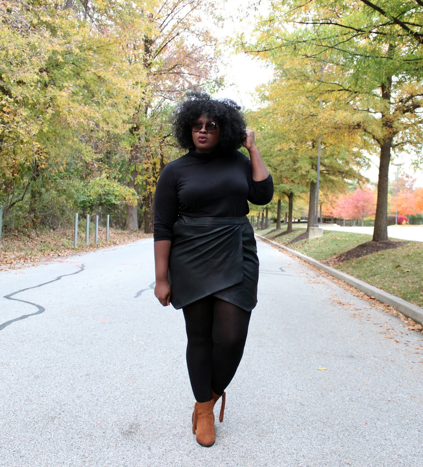 Black Turtleneck with Leather-Like Wrap Skirt — Plus Size Thanksgiving Outfits 2026