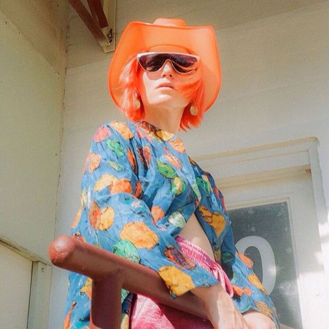 Vibrant Orange Bob With Blunt Bangs — Hat Hairstyles 2027 for Nashville