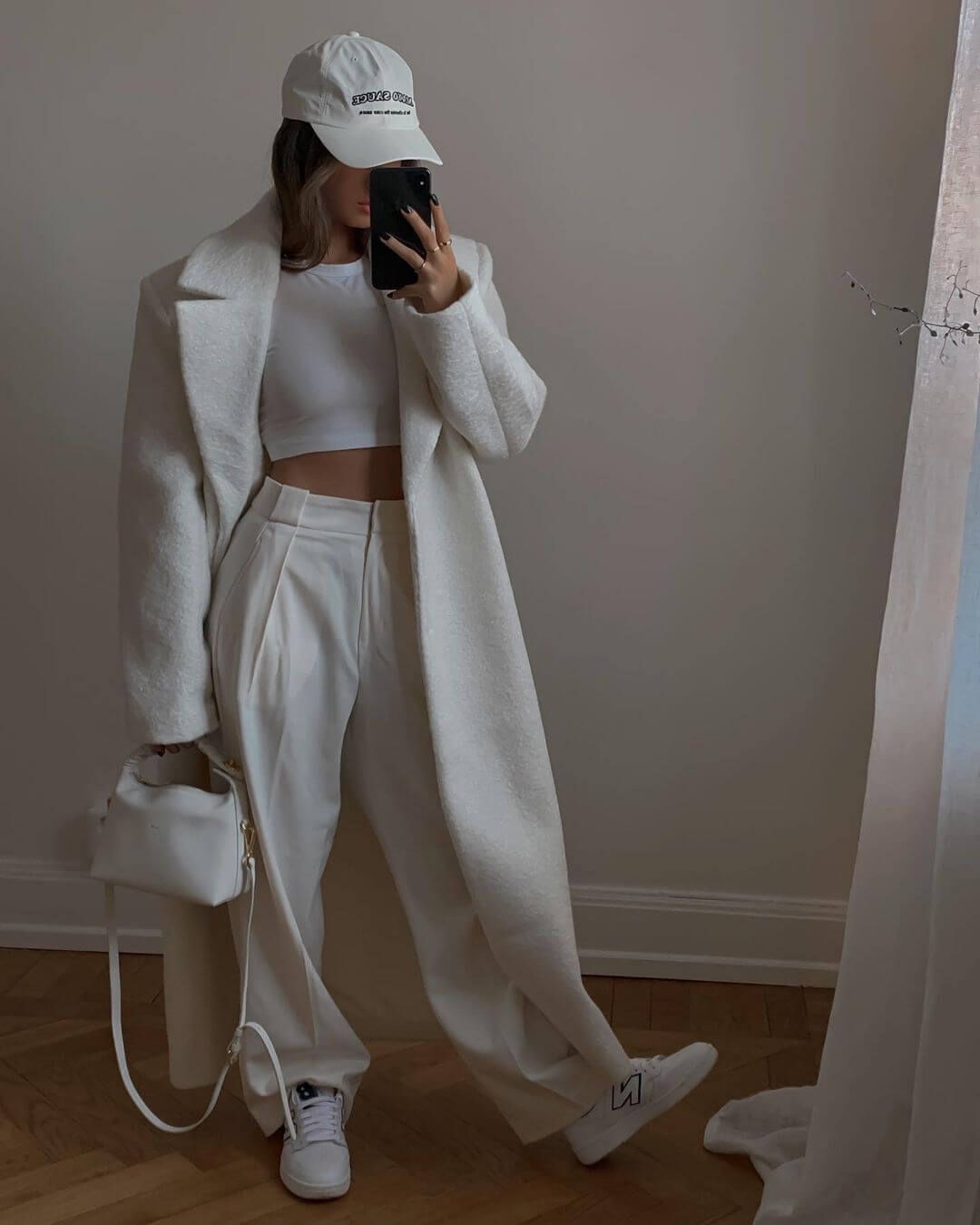 Monochromatic White Ensemble with Oversized Coat and Sneakers — Winter Minimalist Outfits 2027
