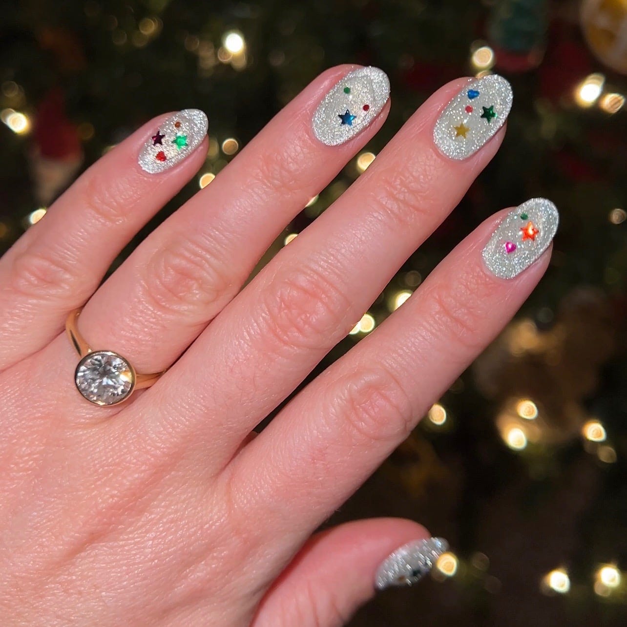 Sparkling Silver Glitter with Star Accents — Short Christmas Nails 2026