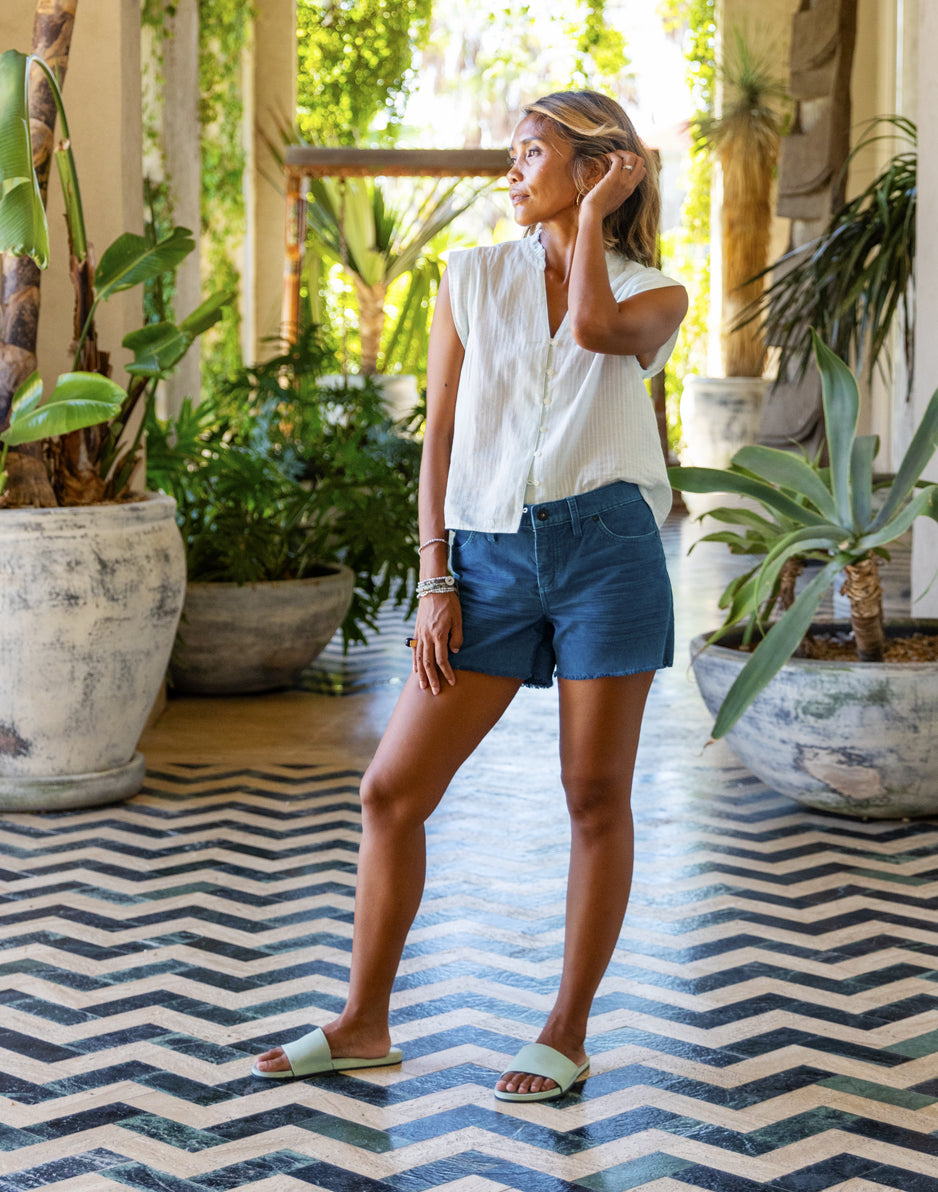 White Linen Top with Frayed Denim Shorts for Relaxed Cruise Style — Cruise Outfits 2027