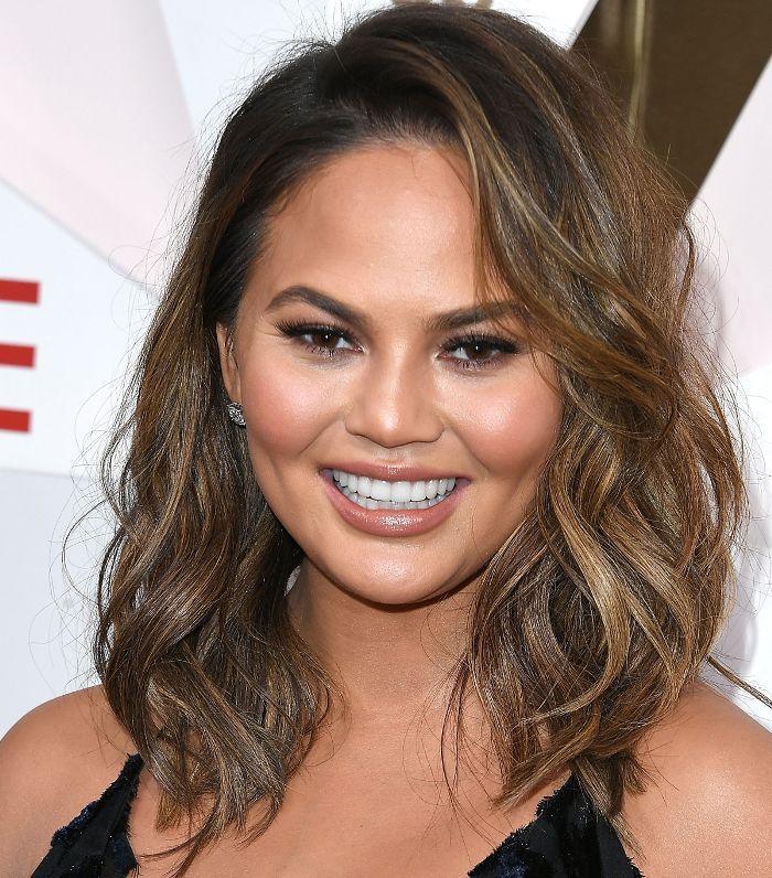 Chin-Length Wavy Bob With Side-Swept Bangs Chin-Length Wavy Bob With Side-Swept Bangs — Winter Haircuts 2027 for Round Faces