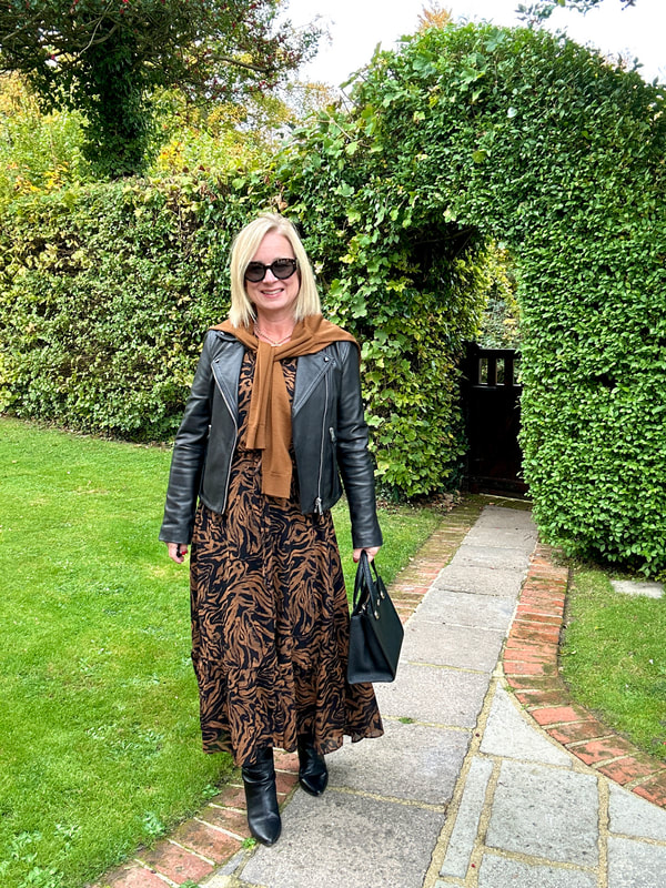 Leather Biker Jacket over Printed Midi Dress: A Textured Spring Date Look Leather Biker Jacket over Printed Midi Dress: A Textured Spring Date Look — Spring First Date Outfits 2027