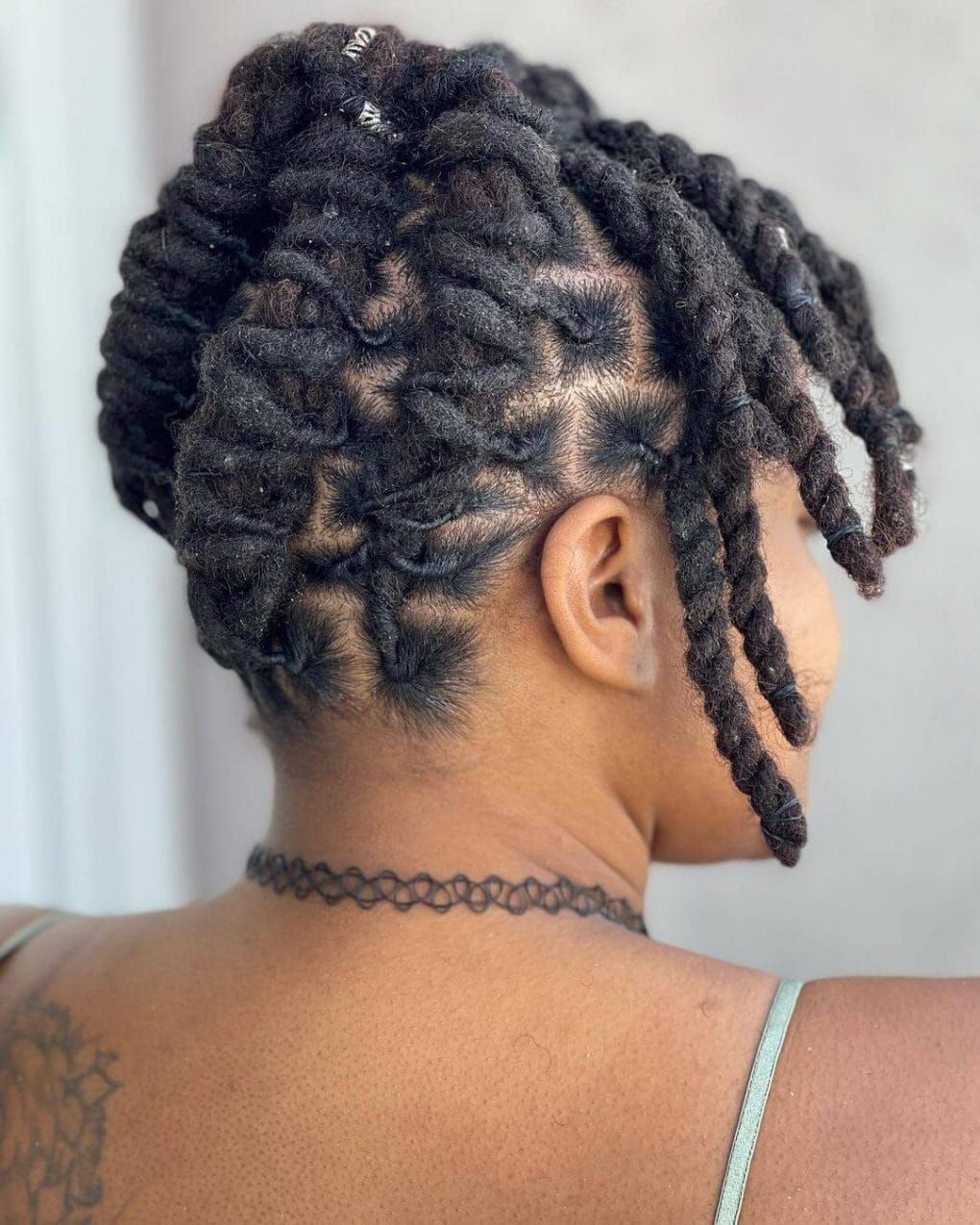 Shoulder Length Coily Locs Updo with Geometric Parting Shoulder Length Coily Locs Updo with Geometric Parting — Loc Styles 2027 for Women Over 50