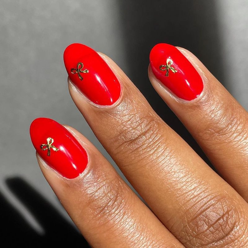 Bright Red with Gold Bow Charms Bright Red with Gold Bow Charms — Red Nails 2027 for Medium Skin