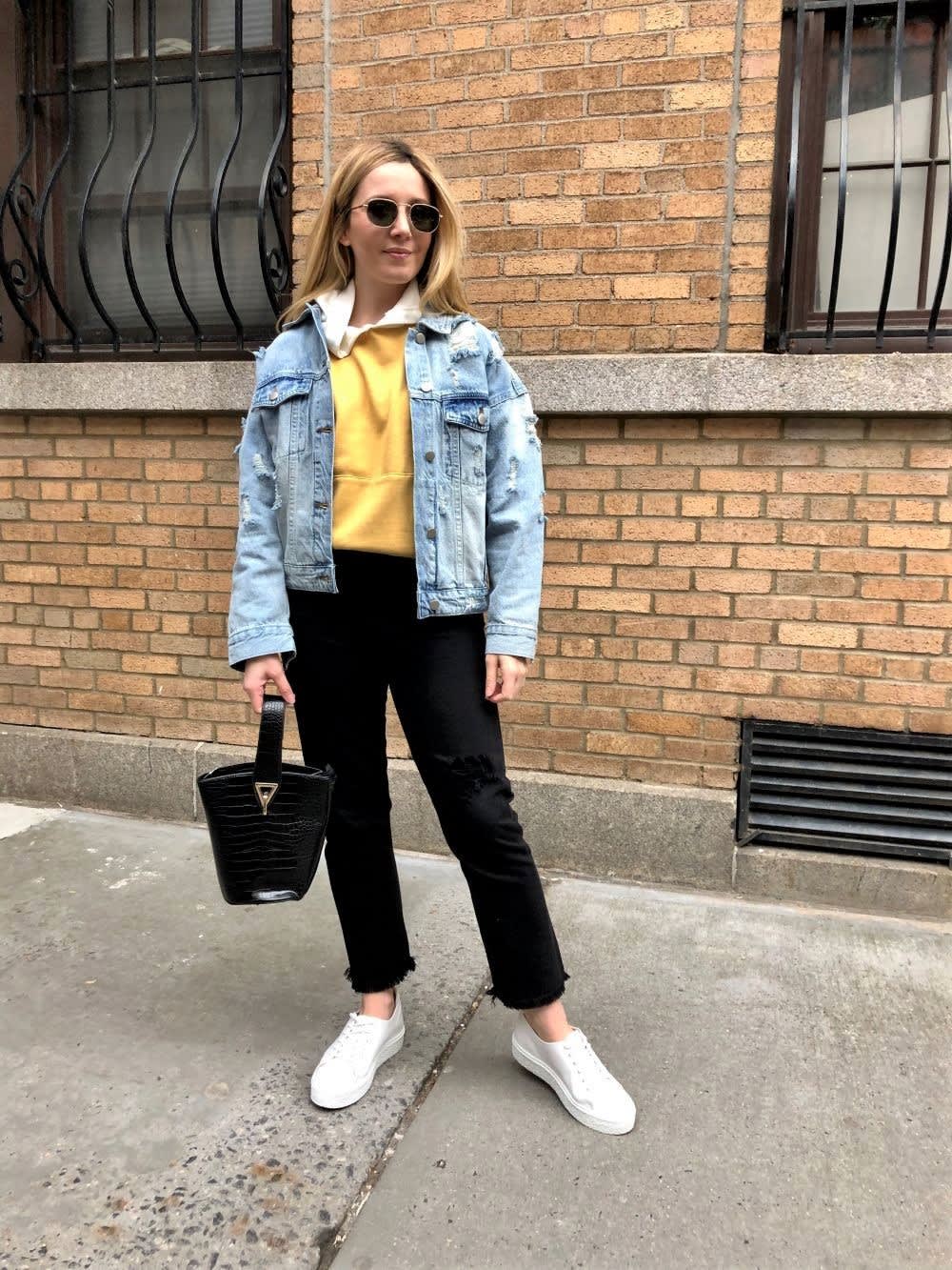 Street Style: Distressed Denim Jacket Over a Hoodie — Denim Jacket Outfits 2027
