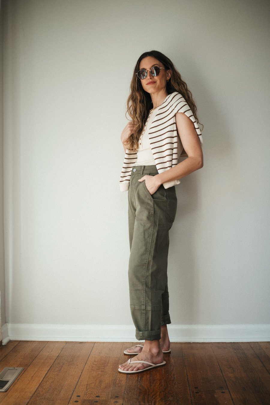Beige Flip-Flops Olive Green Cargo Pants with a Striped Knit Vest Beige Flip-Flops Olive Green Cargo Pants with a Striped Knit Vest — Cargo Pants Outfits 2027