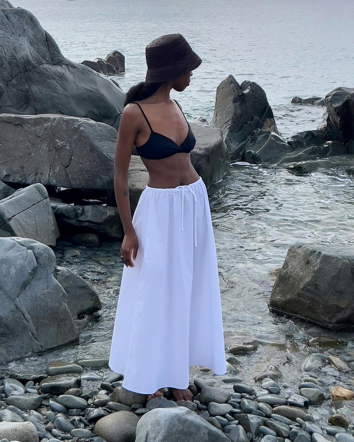 Mid-Back Wavy Dark Brown With Dark Hat — Bucket Hat Hairstyles 2027