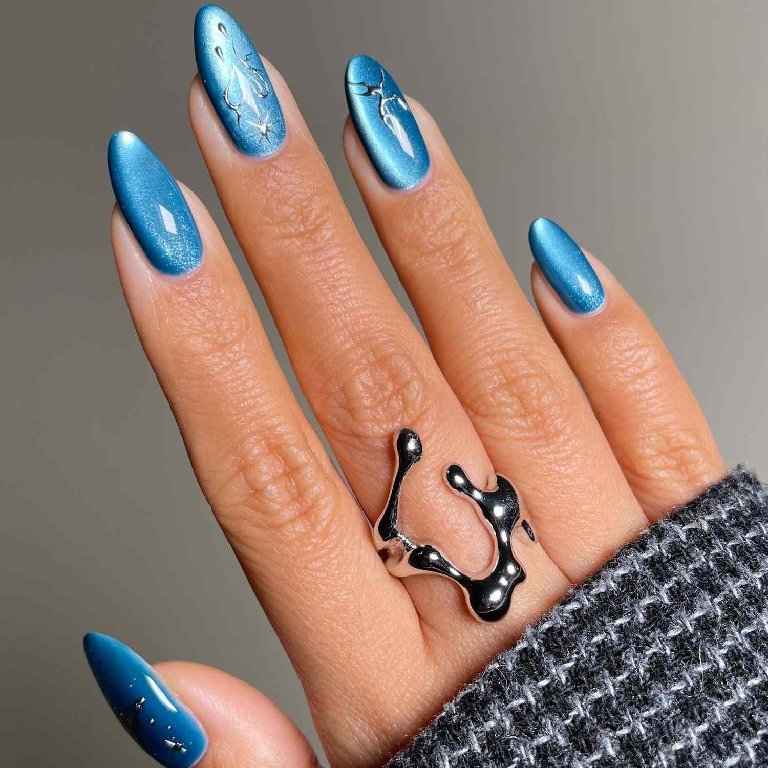 Vibrant Metallic Blue with Celestial Accents Vibrant Metallic Blue with Celestial Accents — Cat Eye Nails 2027