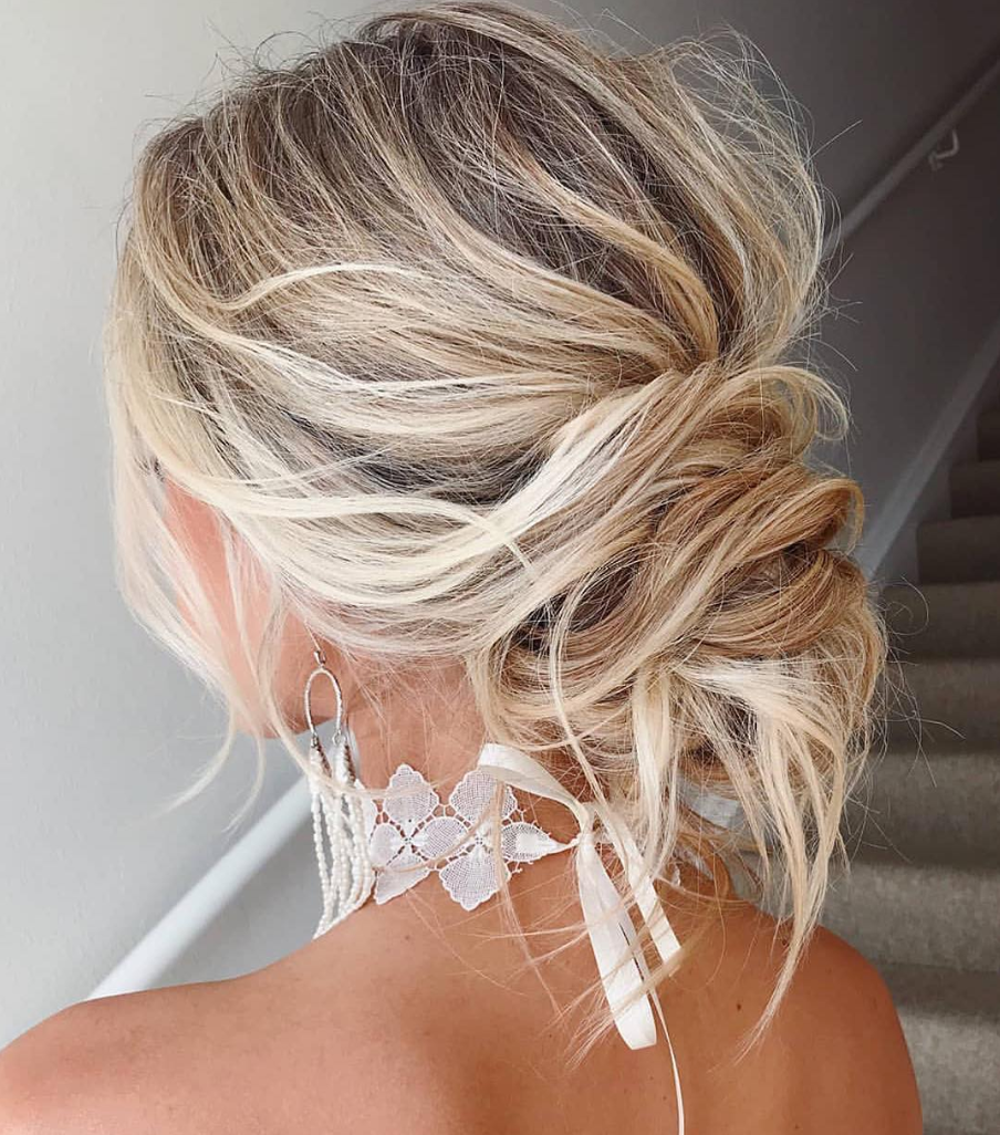 Messy Bun With Loose Strands Blonde Highlights — Knotted Bun Hairstyles 2027