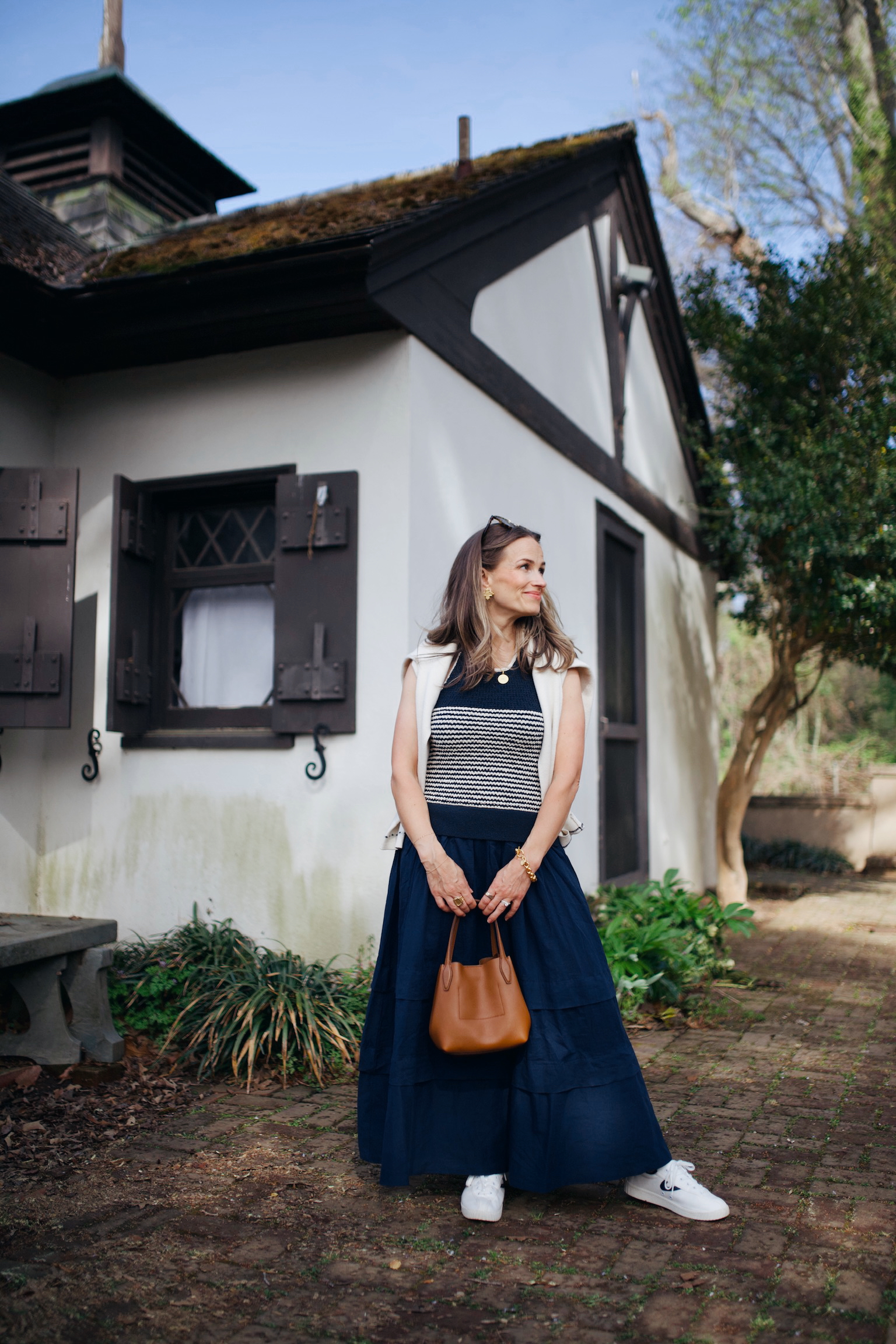 Striped Knit Top, Vest, and Navy Skirt for Warm Exploration Striped Knit Top, Vest, and Navy Skirt for Warm Exploration — Travel Outfits Europe 2027