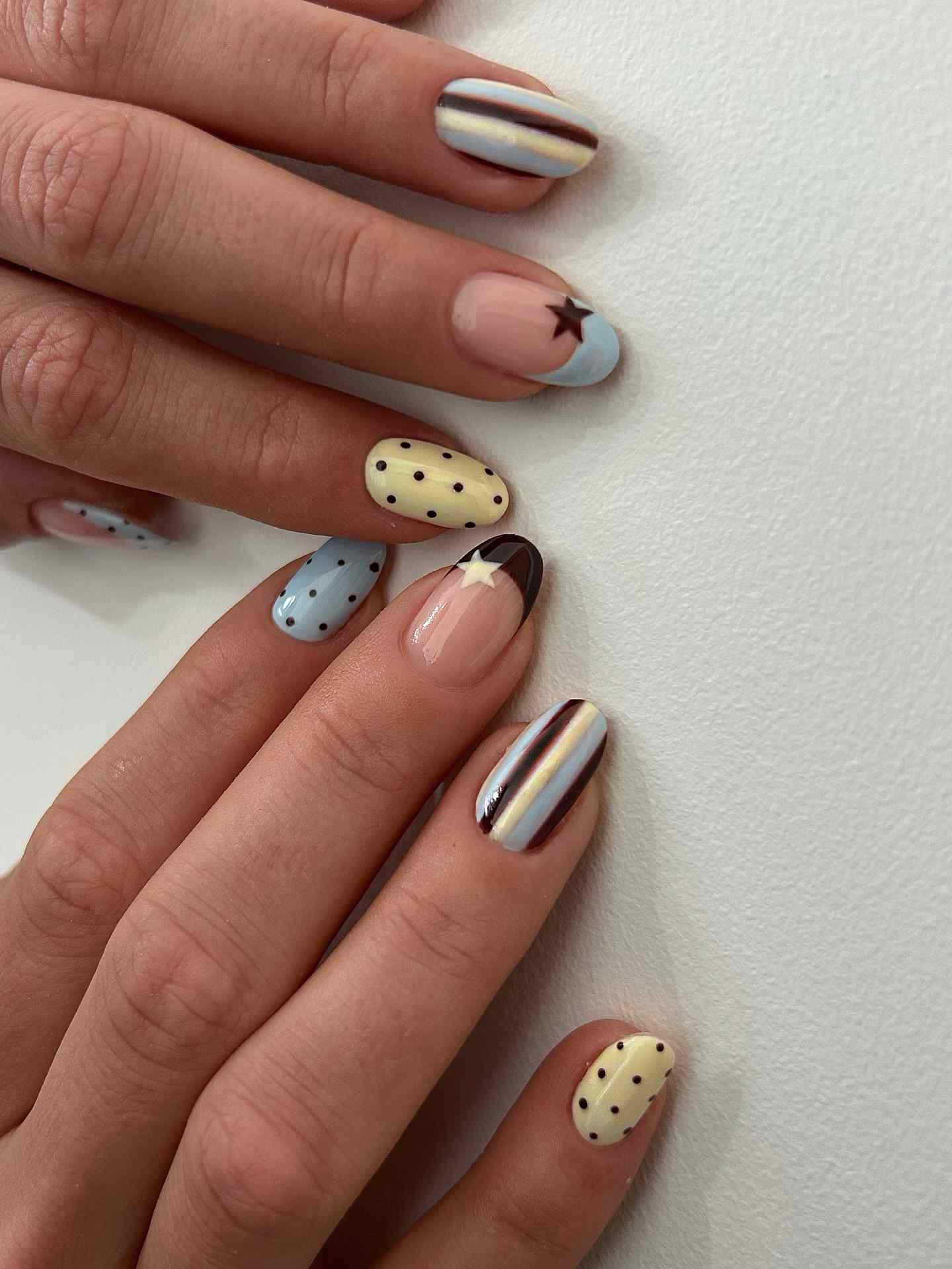 Glossy Medium Almond Nude French Tips with Black Dots Glossy Medium Almond Nude French Tips with Black Dots — Polka Dot Nails 2027