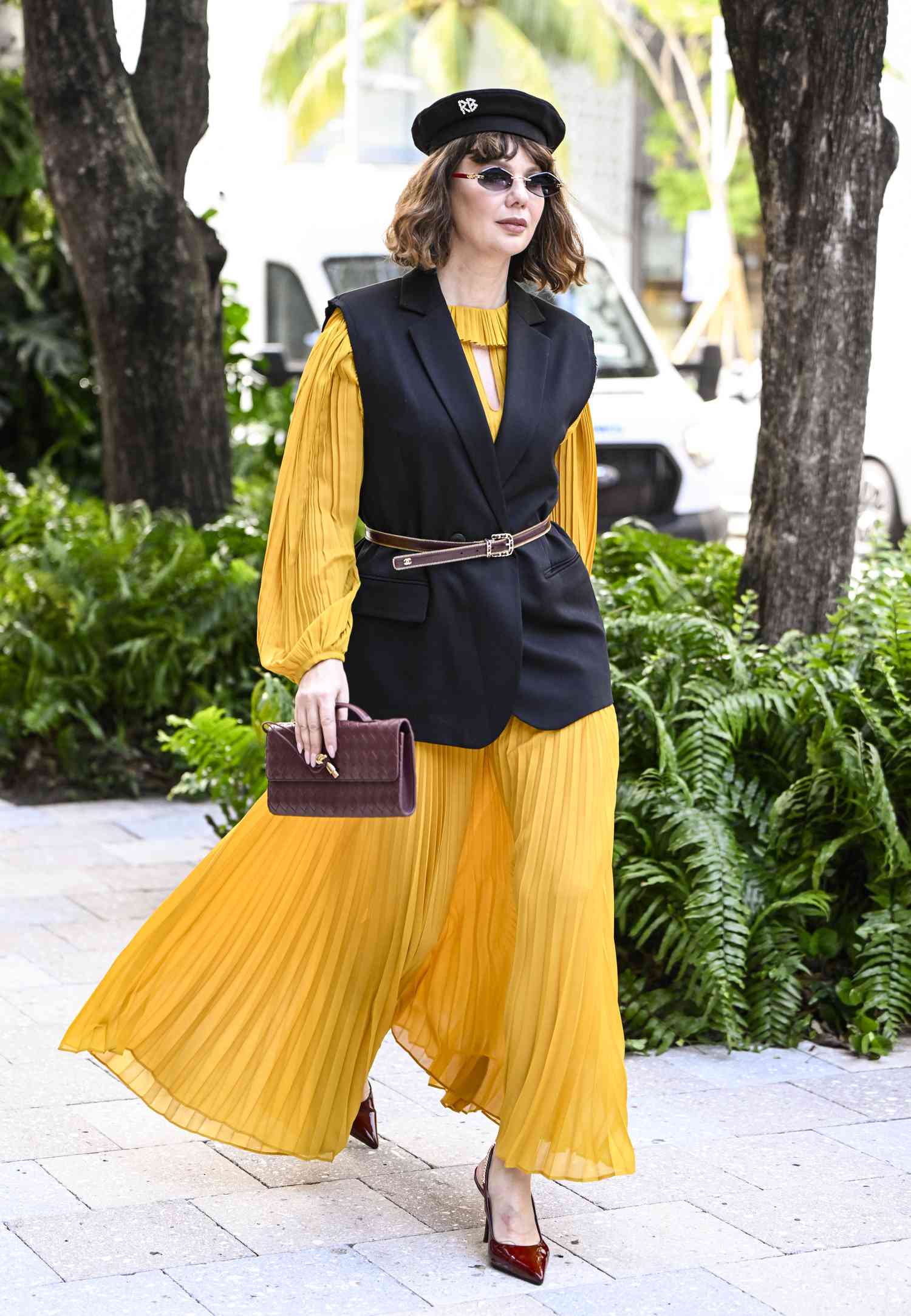 Bold Pleated Dress with a Vest Layer for Artistic Appreciation Bold Pleated Dress with a Vest Layer for Artistic Appreciation — Museum Outfits 2027